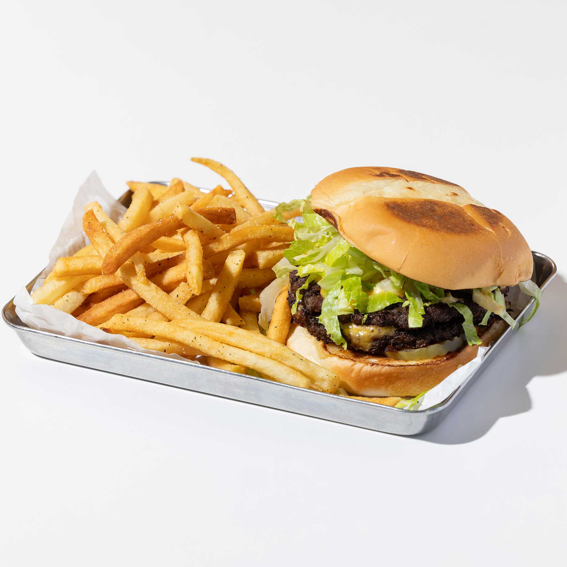 han's take on a big mac, korean style; served in a silver tray with fries